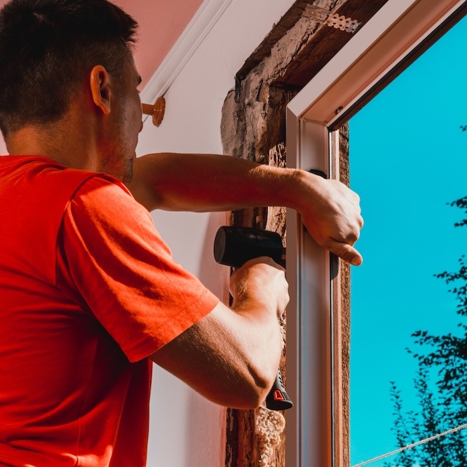 A window replacement is taking place on a sunny day.